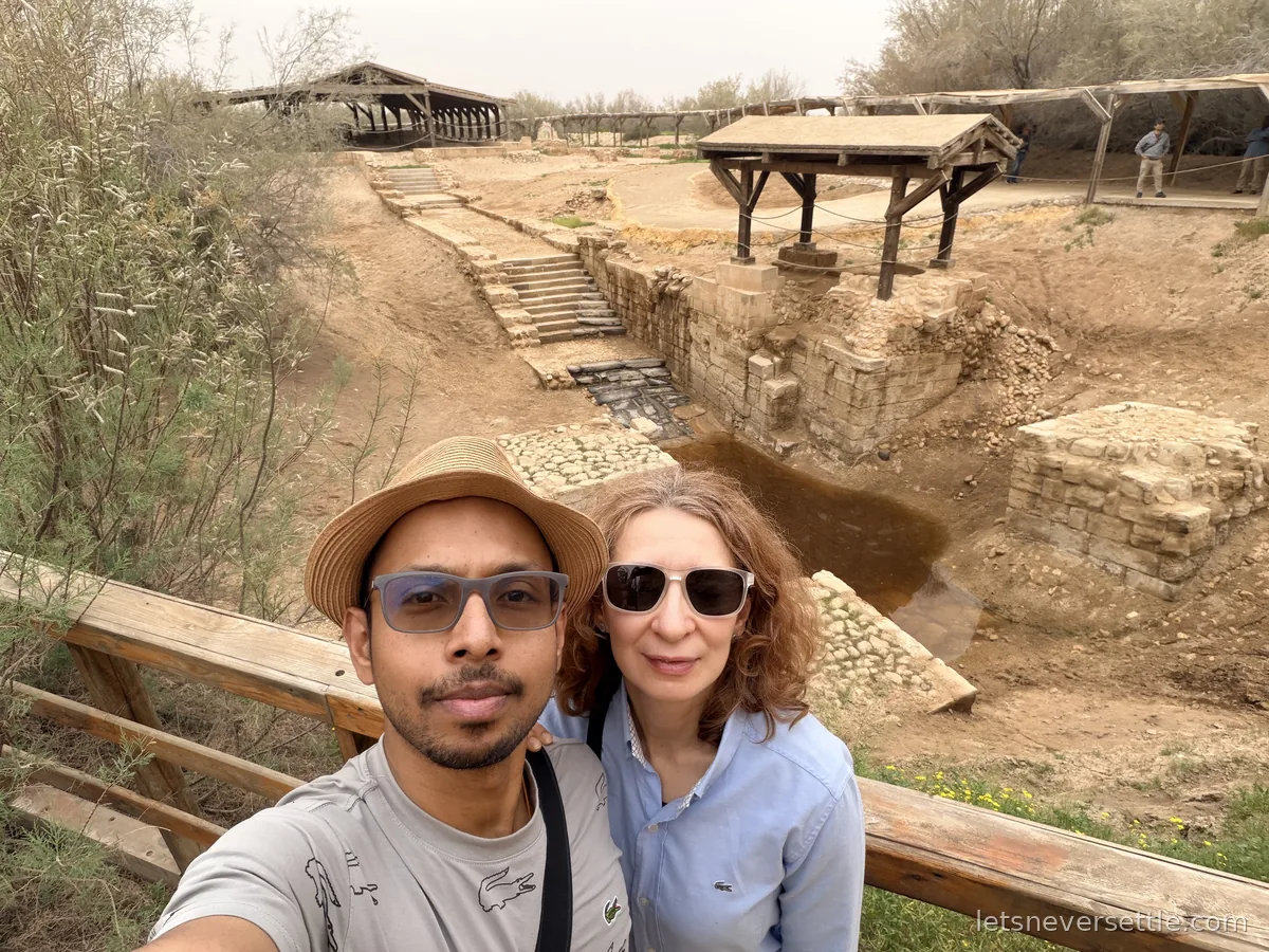 Inga and Dileep in front of the excavated Byzantine baptism pools and steps at Bethany Beyond the Jordan