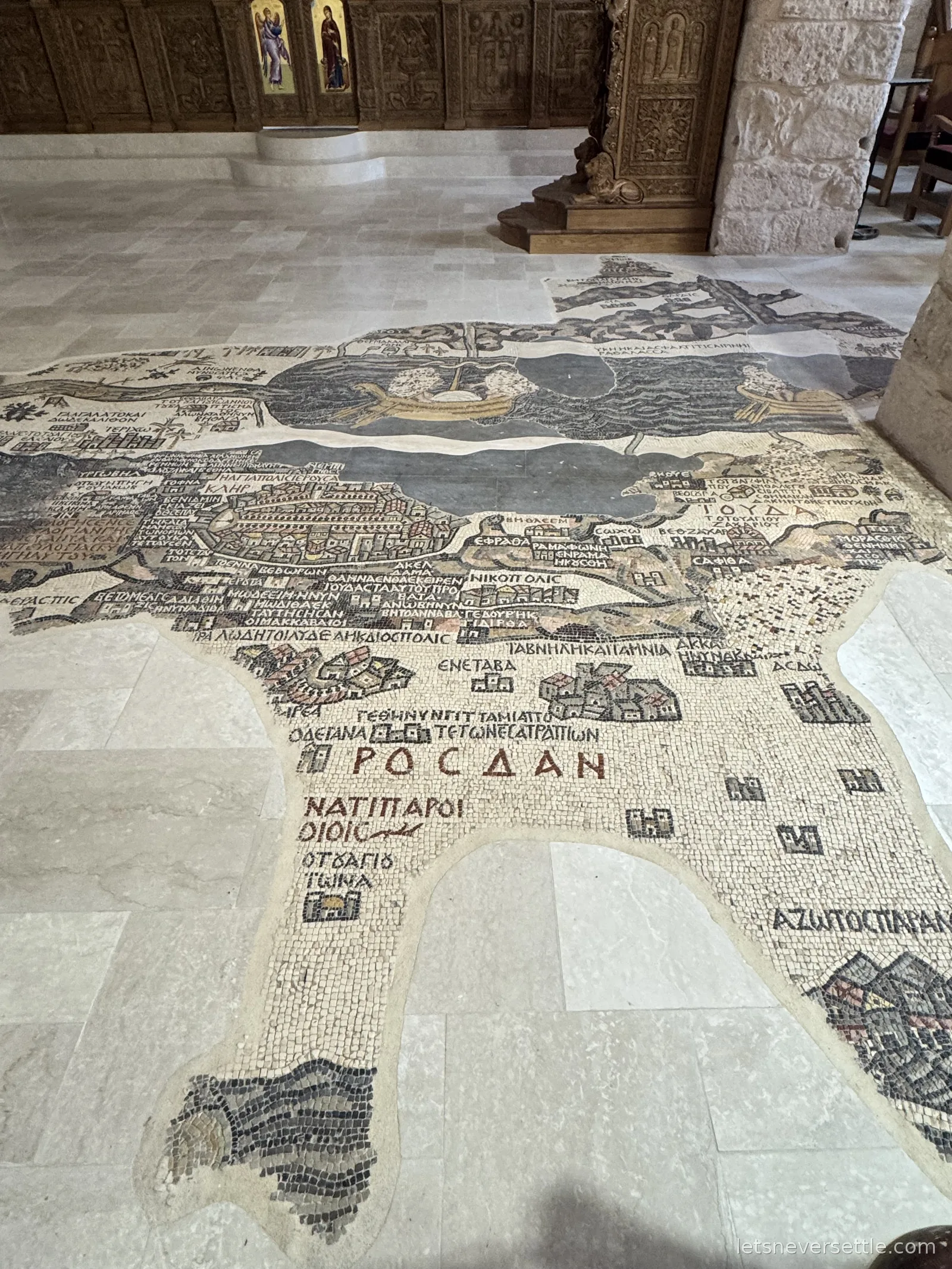 The sixth-century Madaba mosaic map of the Holy Land set into the church floor, with Greek place names in coloured tiles