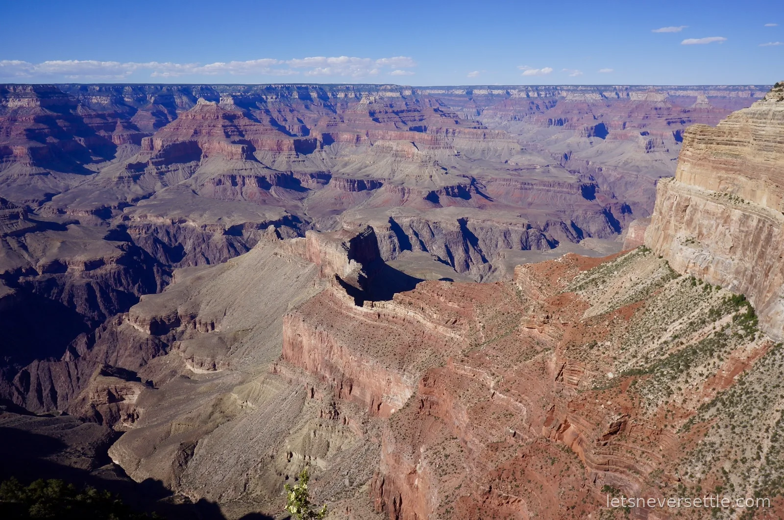 Grand Canyon buttes in low evening light with long shadows filling the gorge