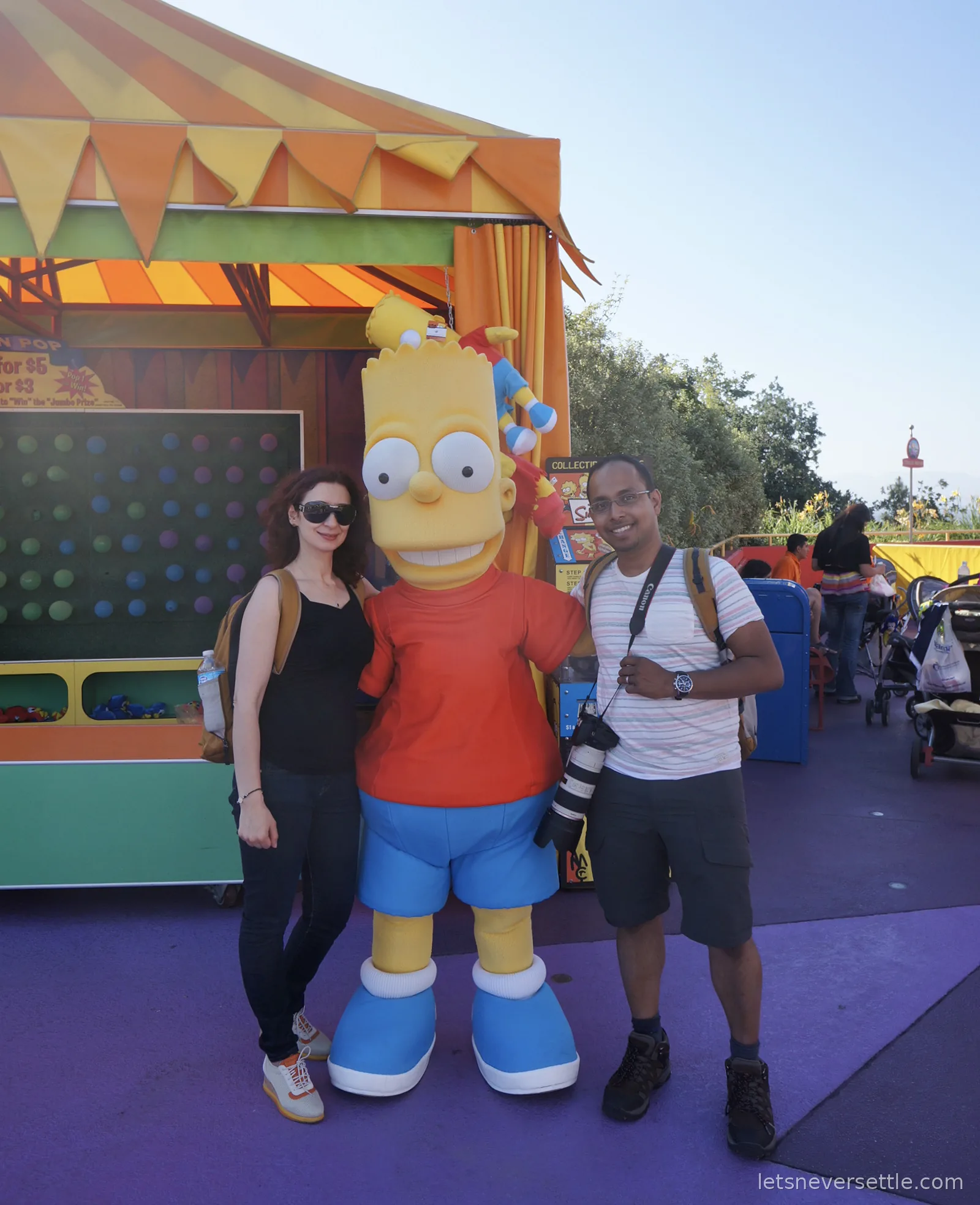 Costumed Bart Simpson character posing with Inga and Dileep at Universal Studios