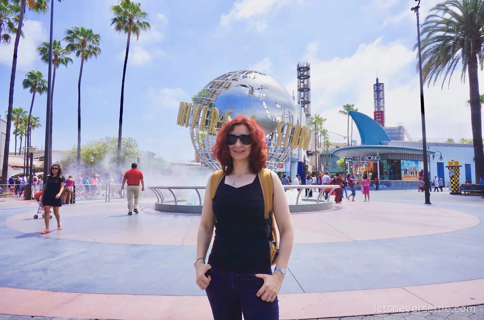 Inga in front of the silver Universal Studios globe fountain