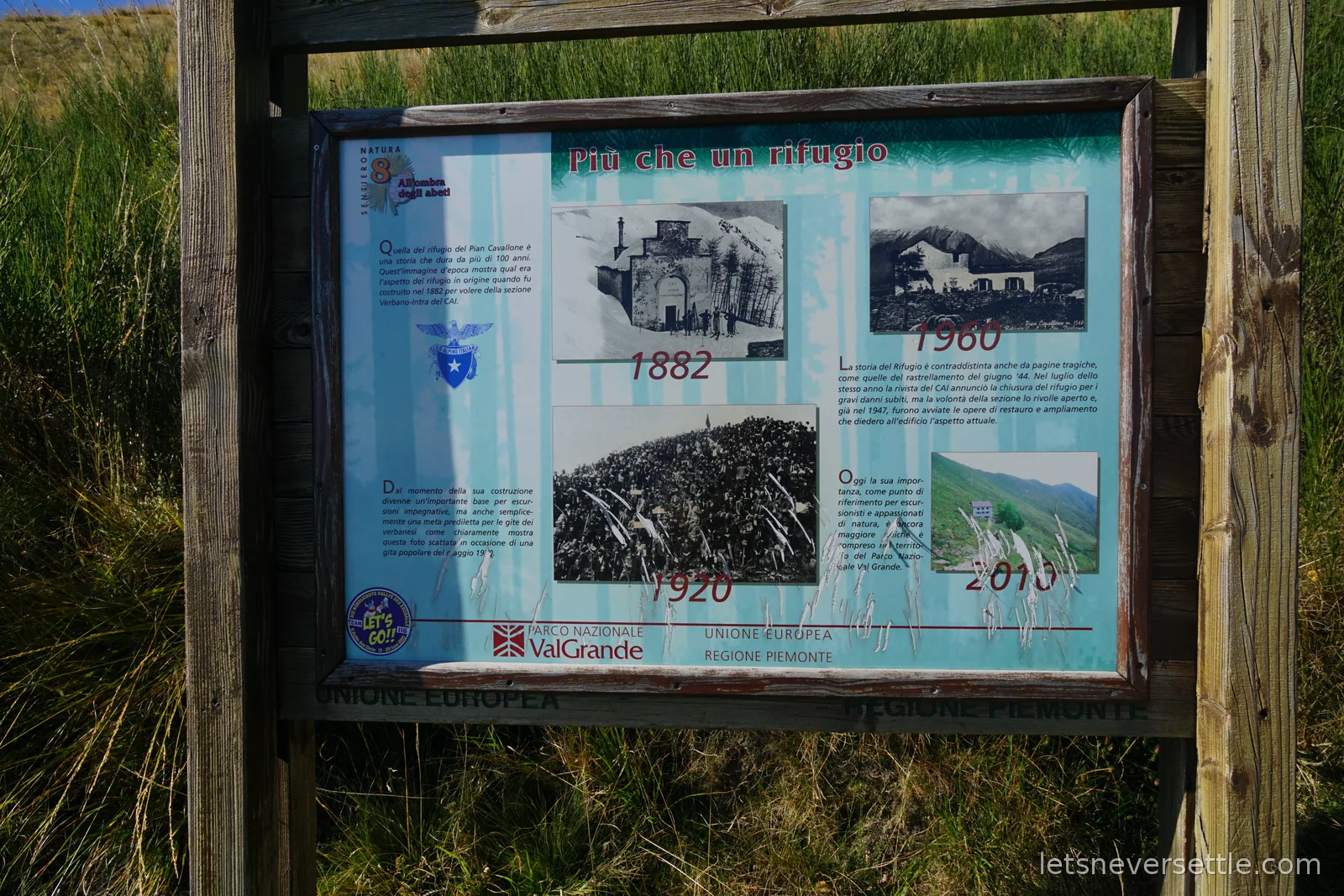 A weathered information board in a timber frame titled Piu che un rifugio, with black and white photographs of the Pian Cavallone refuge dated 1882, 1920, 1960 and 2010, and Parco Nazionale Val Grande logos