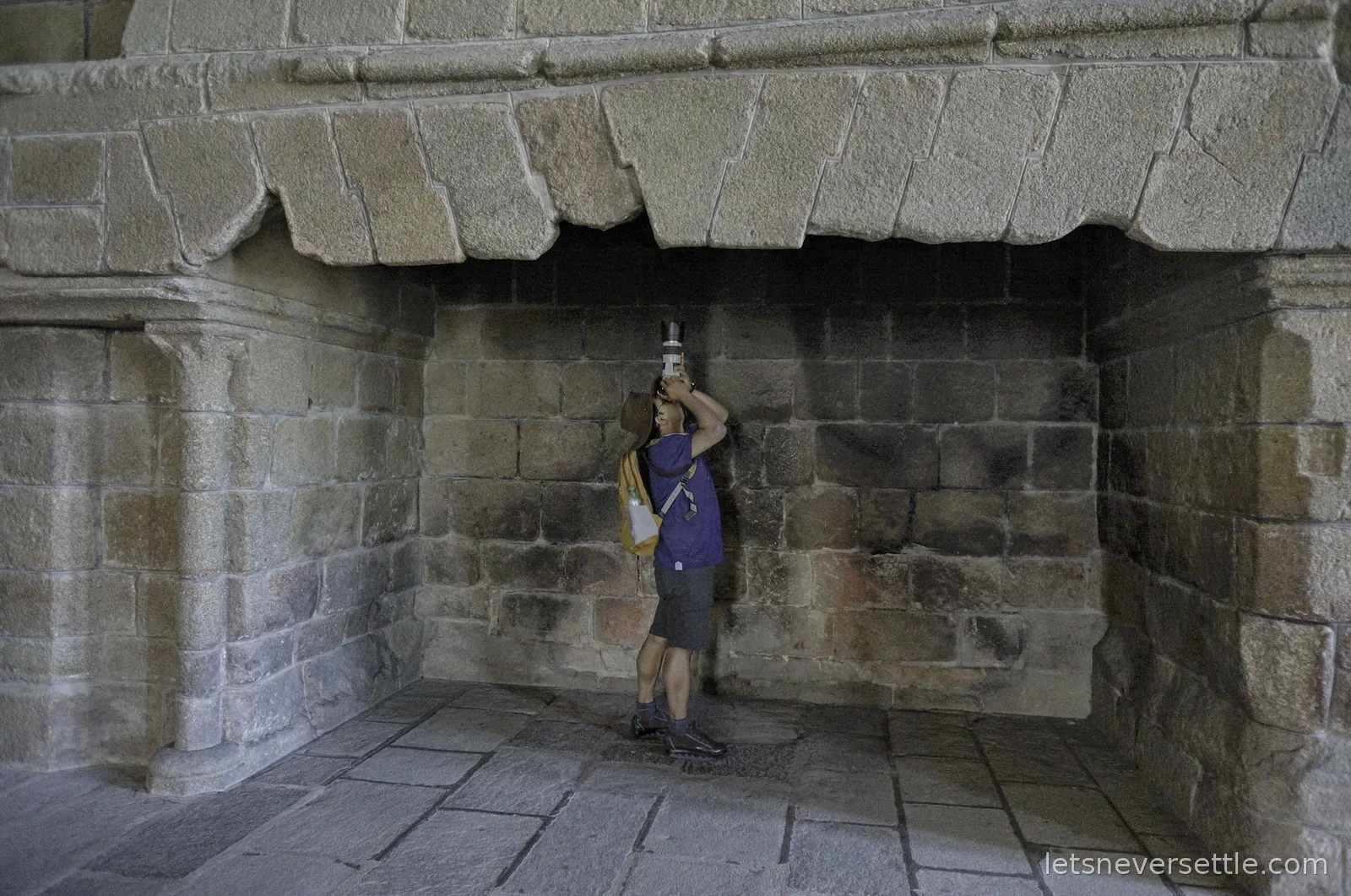 Dileep photographing the chimney inside a huge stone fireplace in the abbey