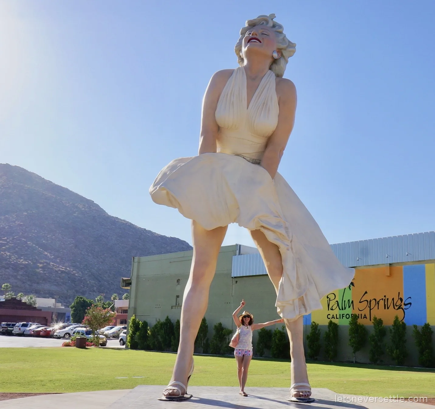 Inga posing beneath the giant Forever Marilyn statue in downtown Palm Springs