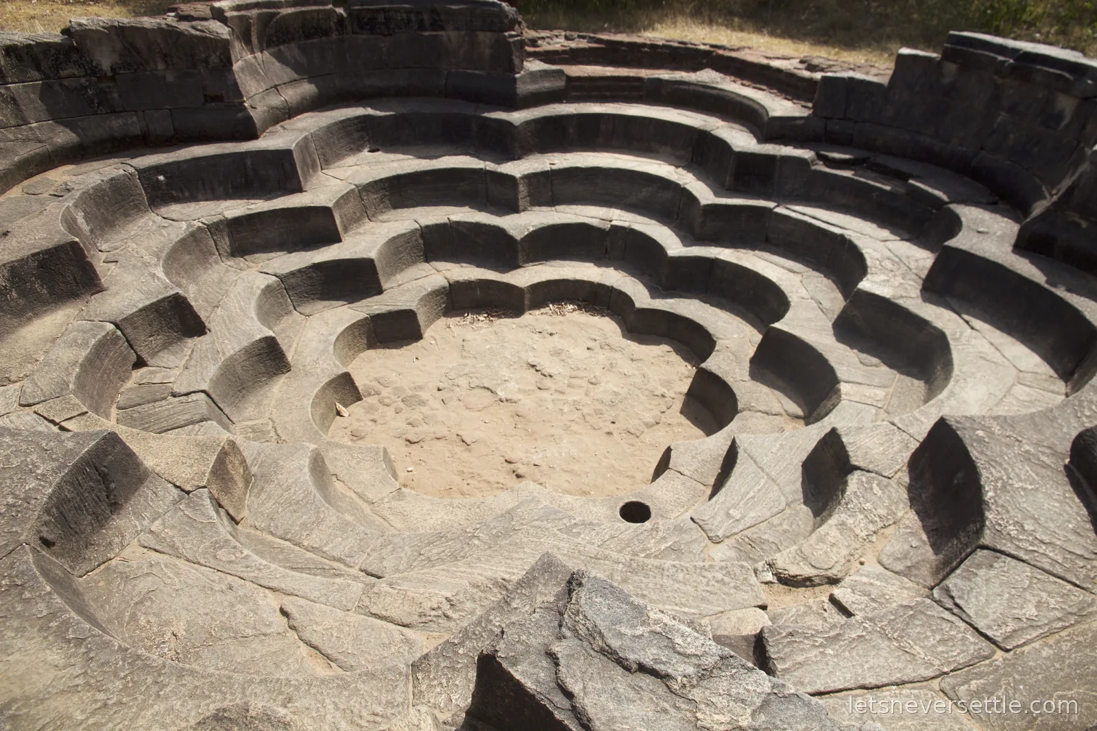 Nelum Pokuna, the lotus pond of Polonnaruwa, a bathing pool of concentric stone petal tiers descending like a flower
