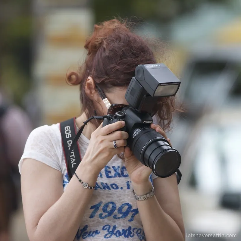 Inga photographing with a DSLR and a large lens in Sri Lanka