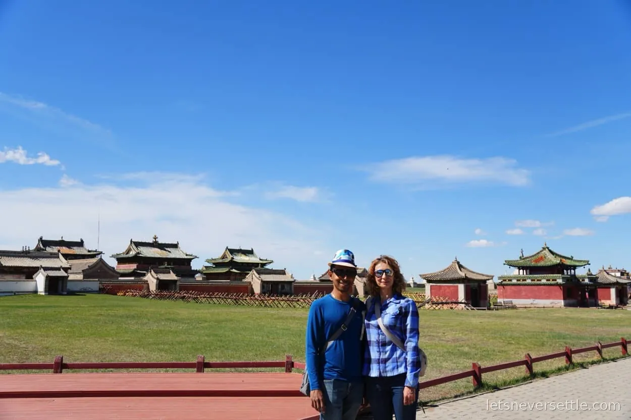 The white stupa-topped boundary wall of Erdene Zuu monastery stretching across the grass