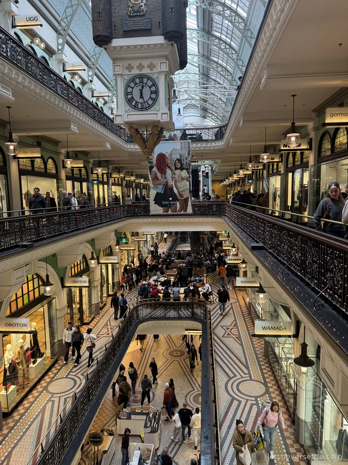 Interior of the Queen Victoria Building in Sydney with tiered arcades, mosaic floors and the Royal Clock